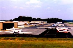 Airport showing airplanes and hangars